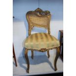 A gilt painted chair with bergère back. Contactless collection is strictly by appointment on