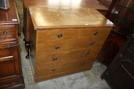 A Victorian scumbled pine straight front chest of drawers with two short and three long drawers,