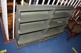 Pair of green painted waterfall bookcases with single drawer, 61cm wide. Contactless collection is