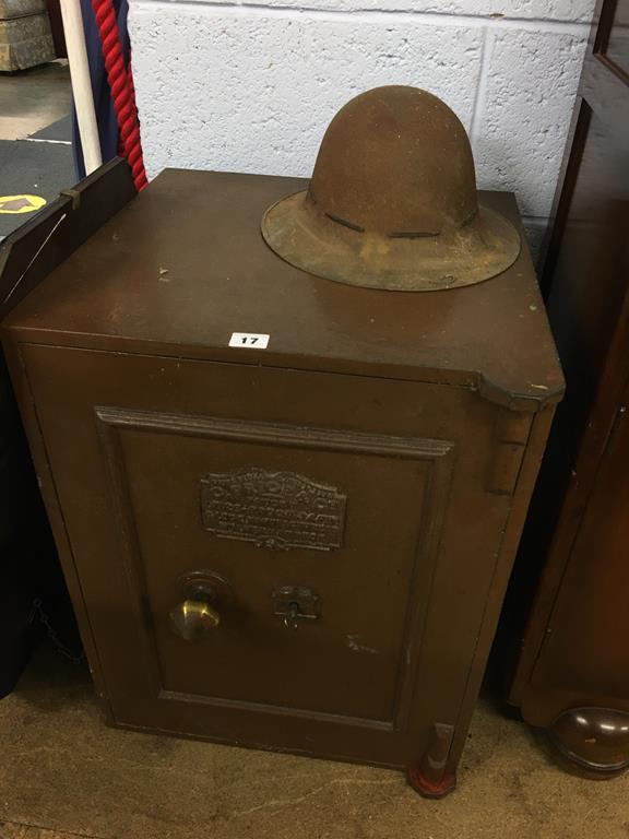 Safe and key by G. Price and Co. and a helmet. Contactless collection is strictly by appointment