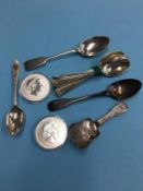 Various silver spoons and two commemorative silver coins, 7 oz. Contactless collection is strictly