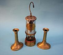 A Miners lamp and a pair of brass candlesticks. Contactless collection is strictly by appointment on