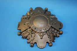 A carved wood sign, International Exhibition London 1913, 34cm diameter. Contactless collection is