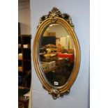 Gilt oval mirror. Contactless collection is strictly by appointment on Thursday, Friday and Saturday