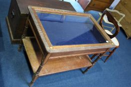 An oak glazed jewellery cabinet, with turned legs and plain under tier, 92cm wide. Contactless