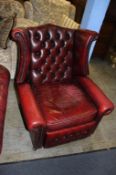 Oxblood Chesterfield wing back armchair. Contactless collection is strictly by appointment on