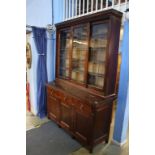 A pine dresser with three sliding glass doors and three drawers, with cupboard door below, 160