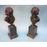 Two 19th century bronze busts of children, supported on square veined marble plinths, 39cm high.