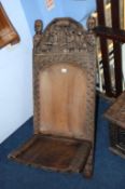 A carved tribal seat. Contactless collection is strictly by appointment on Thursday, Friday and