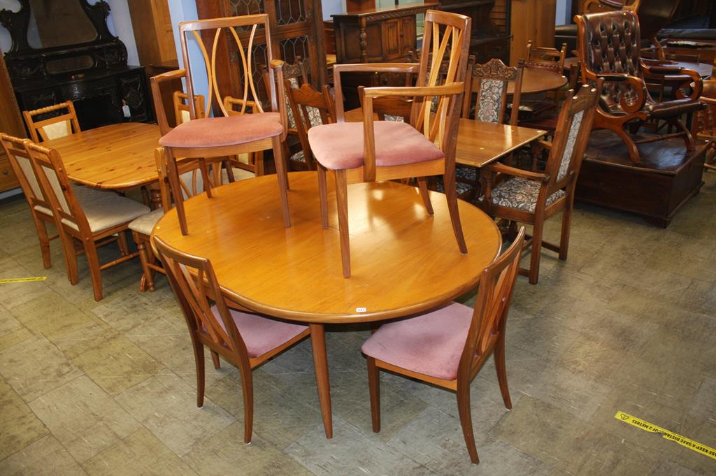 A G Plan teak extending dining table and six chairs