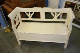 A white painted bench