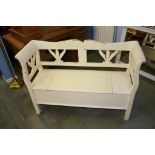 A white painted bench