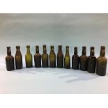 Twelve glass advertising bottles, Newcastle Upon Tyne to include, Emmerson Bros., Bradford Bros., J.