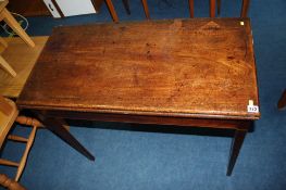 A 19th century mahogany fold over tea table