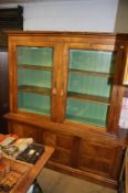 A large Barker and Stonehouse double glazed bookcase, with cupboards below, 207cm wide, 53cm deep,