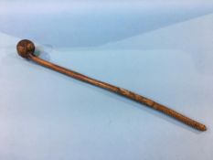 A tribal stick, approx. 63cm in length, some carving and animal hide decoration