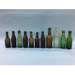 Eleven glass advertising bottles 'Durham' to include; J. J. Macknight, Wood and Watson, Wm Lowery