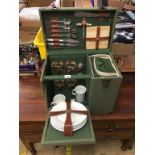 A green canvas picnic hamper, with inset wine cooler
