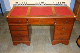 A mahogany pedestal desk, 135cm wide, 56cm deep