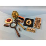 A Silhouette, small telescope, magnifying glass, two glass Harrogate paperweights, a British
