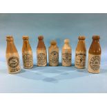 Seven stoneware advertising bottles; Longbothams, Malton, Rutherford and Co. Crook, W. and H. Roome,
