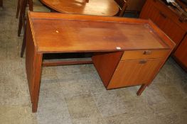 A teak desk, 124cm wide