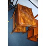 A walnut two tier tray top tea trolley, with drop flaps