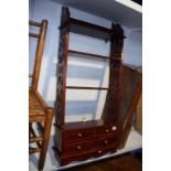 Mahogany open shelves, with four small drawers, 49cm wide