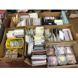 A large quantity of cards, shakers, domes, dies, floral toppers, embossing folders, Xyron Fabric