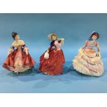 Three Royal Doulton figures 'Hannah', 'Southern Belle' and 'Autumn Breezes'