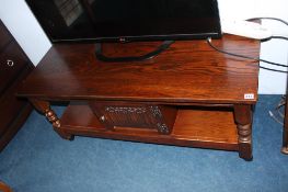 An oak linenfold coffee table