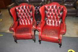 Two Chesterfield wing back armchairs