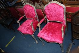 A pair of silver and pink upholstered French style armchairs