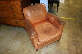 Distressed leather armchair