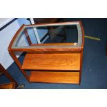 A teak three tier tea trolley, with glass top