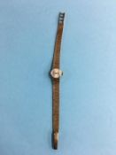 A ladies Seiko 9ct gold watch and strap, total weight 21.3 grams