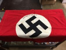 A German Second World War flag, 'Captured in Crete May 12th 1941', 96 x 77cm
