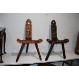 Two carved wood stools