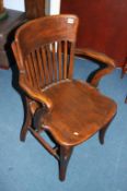 A 1930s oak office chair