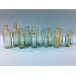 Twelve glass advertising bottles 'Gateshead' to include; Joseph Wilkinson, 3 J. Wilkinson, Wood
