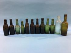 Twelve glass advertising bottles 'South Shields' to include; P. V. Tinwell, R. Henderson, M. Wood