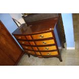 An American Williamsburg bow front chest, with four long drawers, 104cm wide