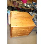 Two pine chest of drawers and a headboard