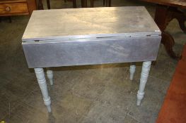 A pine drop flap table, with aluminium top