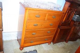 An Edwardian chest of drawers, with two short and three long graduated drawers, supported on