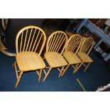 A set of teak Windsor chairs