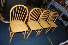 A set of teak Windsor chairs
