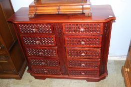 A reproduction mahogany chest of ten short drawers, 115cm wide