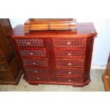 A reproduction mahogany chest of ten short drawers, 115cm wide