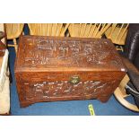 A large Oriental carved camphorwood chest, 101cm wide